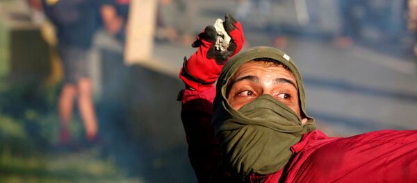 استمرار الاحتجاجات ضد الرئيس نيكولاس مادورو في كاراكاس، فنزويلا 18 مايو/ آيار 2017 - سبوتنيك عربي