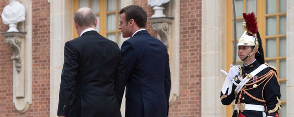 الرئيس الروسي فلاديمير بوتين والرئيس الفرنسي إيمانويل ماكرون في باريس - سبوتنيك عربي