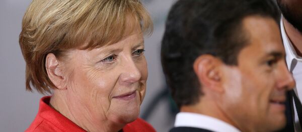 ميركل وإنريكي بينيا نييتو - سبوتنيك عربي