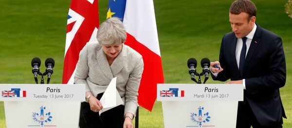 ماكرون وتريزا ماي - سبوتنيك عربي