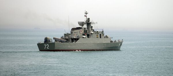 In this Tuesday, April 7, 2015, file photo released by the semi-official Fars News Agency, Iranian warship Alborz, foreground, prepares before leaving Iran's waters, at the Strait of Hormuz In this Tuesday, April 7, 2015, file photo released by the semi-official Fars News Agency, Iranian warship Alborz, foreground, prepares before leaving Iran's waters, at the Strait of Hormuz - سبوتنيك عربي