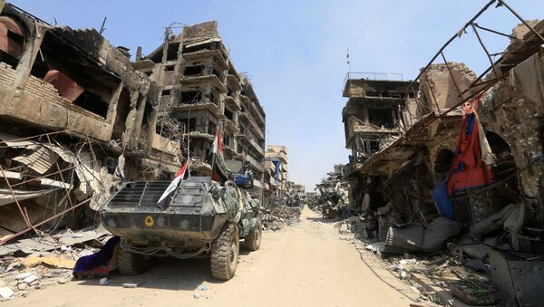 مدرعة عسكرية عراقية في مدينة الموصل، العراق 9  يوليو/ تموز 2017 - سبوتنيك عربي