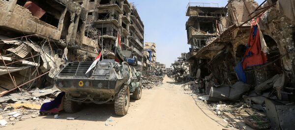 مدرعة عسكرية عراقية في مدينة الموصل، العراق 9  يوليو/ تموز 2017 - سبوتنيك عربي