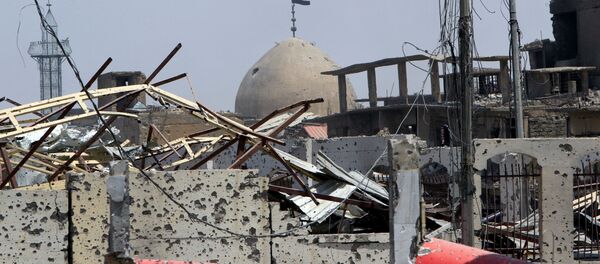 العلم العراقي في مدينة الموصل، العراق 9 يوليو/ تموز 2017 - سبوتنيك عربي