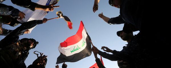 الشرطة العراقية تحتفل بتحرير الموصل، العراق 9 يوليو/ تموز 2017 - سبوتنيك عربي