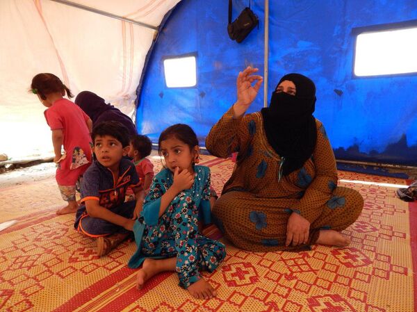 عائلات الدواعش من وهم الخلافة إلى خيام الإيواء في صحراء الموصل عائلات الدواعش من وهم الخلافة إلى خيام الإيواء في صحراء الموصل - سبوتنيك عربي