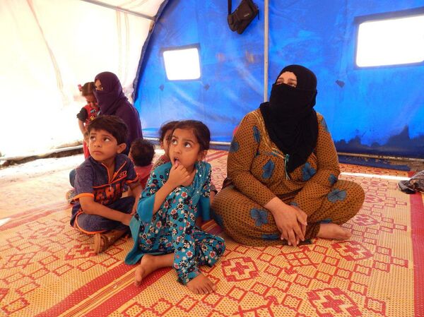 عائلات الدواعش من وهم الخلافة إلى خيام الإيواء في صحراء الموصل عائلات الدواعش من وهم الخلافة إلى خيام الإيواء في صحراء الموصل - سبوتنيك عربي