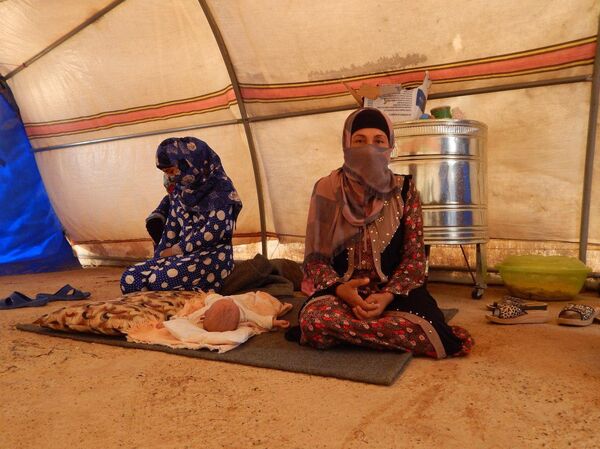 عائلات الدواعش من وهم الخلافة إلى خيام الإيواء في صحراء الموصل عائلات الدواعش من وهم الخلافة إلى خيام الإيواء في صحراء الموصل - سبوتنيك عربي