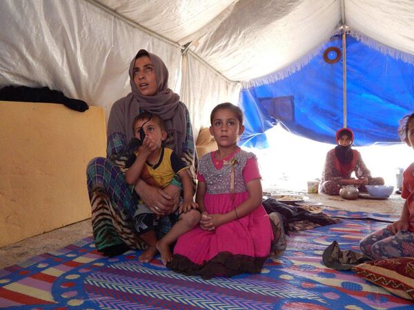 عائلات الدواعش من وهم الخلافة إلى خيام الإيواء في صحراء الموصل عائلات الدواعش من وهم الخلافة إلى خيام الإيواء في صحراء الموصل - سبوتنيك عربي