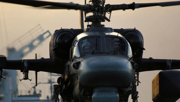 Вертолет Ка-52К взлетает с палубы тяжелого авианесущего крейсера Адмирал Кузнецов в Средиземном море - سبوتنيك عربي