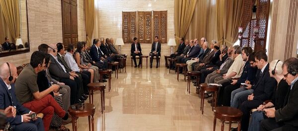 لقاء الأسد ووفد الملتقى النقابي الدولي - سبوتنيك عربي