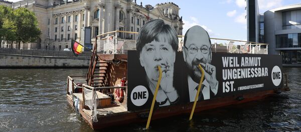 لوحة أنجيلا ميركل وشولتس - سبوتنيك عربي