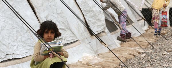 أطفال النازحين من الموصل في مدرسة تابعة لمؤسسة يونيسف شمال العراق، 20 نوفمبر/ تشرين الثاني 2017 أطفال النازحين من الموصل في مدرسة تابعة لمؤسسة يونيسف شمال العراق، 20 نوفمبر/ تشرين الثاني 2017 - سبوتنيك عربي