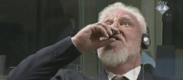 A wartime commander of Bosnian Croat forces, Slobodan Praljak, is seen during a hearing at the U.N. war crimes tribunal in the Hague, Netherlands, November 29, 2017 - سبوتنيك عربي