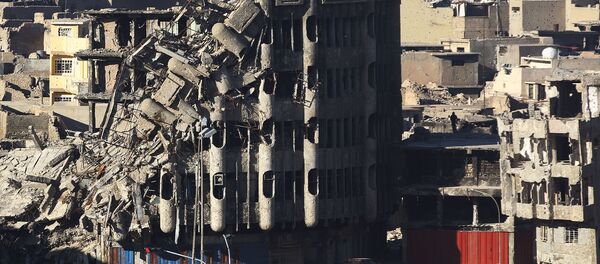 حجم الدمار في أحدى شوارع الموصل بعد تحريرها من داعش حجم الدمار في أحدى شوارع الموصل بعد تحريرها من داعش - سبوتنيك عربي