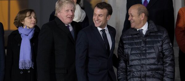 بوريس جونسون وايمانويل ماكرون - سبوتنيك عربي