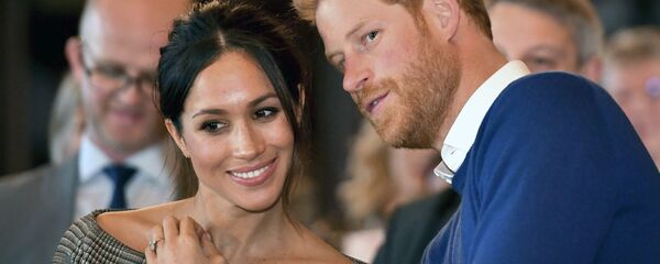 نجل ولي عهد بريطانيا الأمير هاري مع خطيبته الأمريكية ميغان ماركل - سبوتنيك عربي