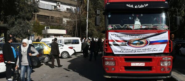وفد من الشخصيات الدينية في روسيا يزور دمشق - توزيع المساعدات الإنسانية - سبوتنيك عربي