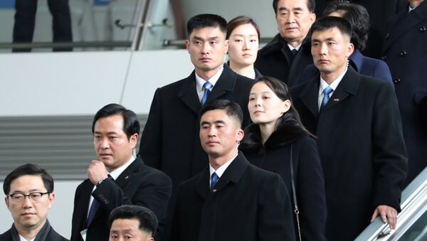 Kim Yo Jong, the younger sister of North Korean leader Kim Jong Un, is escorted by South Korean security guards at the Incheon International Airport, in Incheon, South Korea February 9, 2018 - سبوتنيك عربي