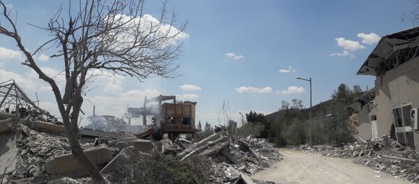 ضربات التحالف الثلاثي التي طالت مركز البحوث العلمية في برزة، سوريا 14 أبريل/ نيسان 2018 - سبوتنيك عربي