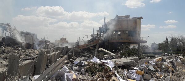 ضربات التحالف الثلاثي التي طالت مركز البحوث العلمية في برزة، سوريا 14 أبريل/ نيسان 2018 - سبوتنيك عربي