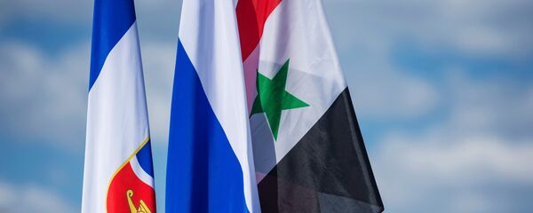 العلم الروسي و السوري - سبوتنيك عربي
