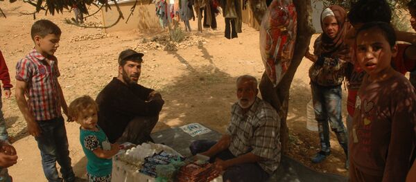 نازحون يعملون بطرق مختلفة لتأمين المال - سبوتنيك عربي