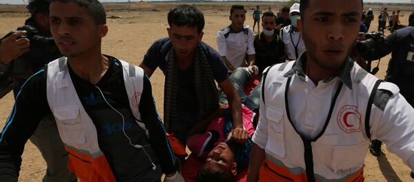 احتجاجات تعم البلاد ضد نقل السفارة الأمريكية إلى القدس، شرق غزة، قطاع غزة، فلسطين 14 مايو/ أيار 2018 احتجاجات تعم البلاد ضد نقل السفارة الأمريكية إلى القدس، شرق غزة، قطاع غزة، فلسطين 14 مايو/ أيار 2018 - سبوتنيك عربي