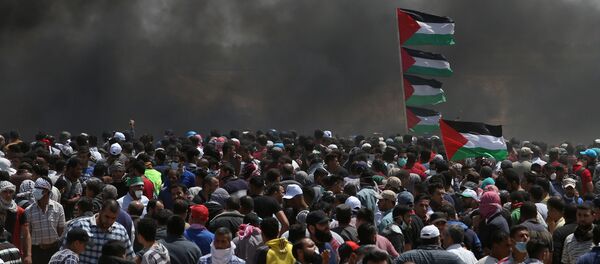  احتجاجات تعم البلاد ضد نقل السفارة الأمريكية إلى القدس عشية الذكرى الـ 70 لـ النكبة ، شرق غزة، قطاع غزة، فلسطين 14 مايو/ أيار 2018 - سبوتنيك عربي