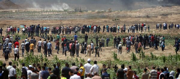 احتجاجات تعم البلاد ضد نقل السفارة الأمريكية إلى القدس عشية الذكرى الـ 70 لـ النكبة ، شرق غزة، قطاع غزة، فلسطين 14 مايو/ أيار 2018 - سبوتنيك عربي