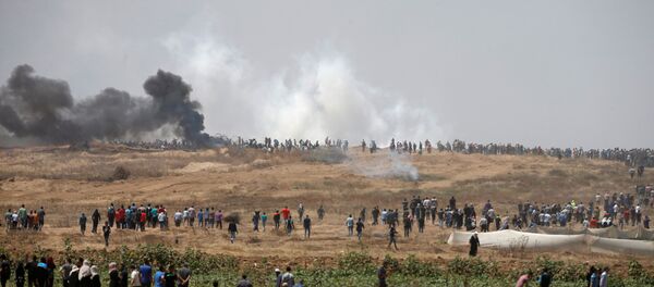 احتجاجات تعم البلاد ضد نقل السفارة الأمريكية إلى القدس عشية الذكرى الـ 70 لـ النكبة ، شرق غزة، قطاع غزة، فلسطين 14 مايو/ أيار 2018 - سبوتنيك عربي