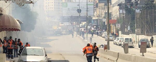 اشتباكات عند حاجز قلنديا المؤدي لمدينة القدس، جنوب رام الله، الضفة الغربية، فلسطين 14 مايو/ أيار 2018 اشتباكات عند حاجز قلنديا المؤدي لمدينة القدس، جنوب رام الله، الضفة الغربية، فلسطين 14 مايو/ أيار 2018 - سبوتنيك عربي