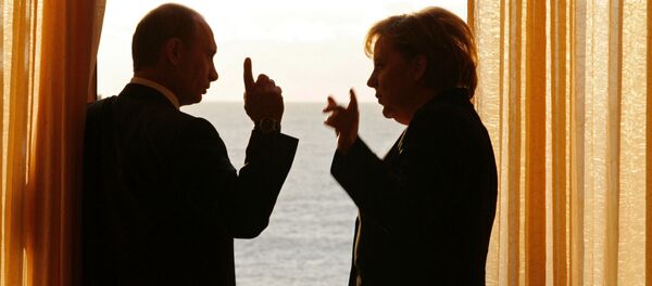 الرئيس الروسي فلاديمير بوتين والمستشارة الألمانية انجيلا ميركل - سبوتنيك عربي