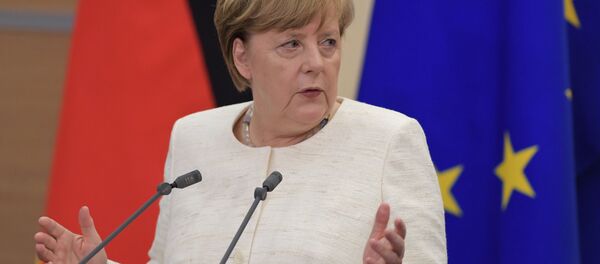 مؤتمر صحفي للرئيس فلاديمير بوتين والمستشارة الألمانية أنجيلا ميركل في سوتشي، 18 مايو/ أيار 2018 - سبوتنيك عربي