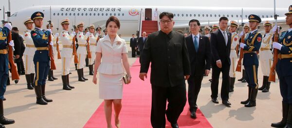 زعيم كوريا الشمالية كيم جونغ أون وعقيلته في الصين  - سبوتنيك عربي