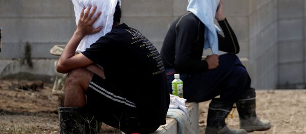 تداعيات الفياضانات في منطقة مابي التابعة لمحافظة أوكاياما، اليابان 10 يوليو/ تموز 2018 - سبوتنيك عربي