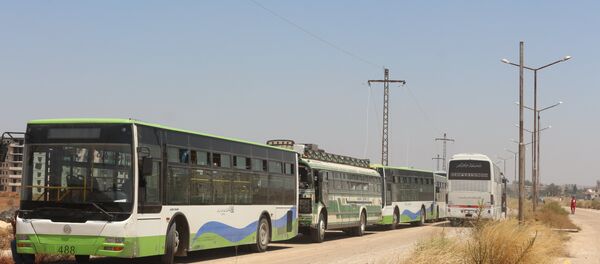 حافلات تقل المسلحين من درعا إلى الشمال السوري حافلات تقل المسلحين من درعا إلى الشمال السوري - سبوتنيك عربي