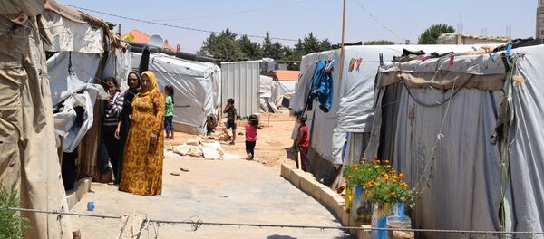  مخيم للنازحين السوريين في منطقة العقيدية في لبنان - سبوتنيك عربي