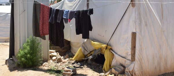 مخيم للنازحين السوريين في منطقة العقيدية في لبنان - سبوتنيك عربي