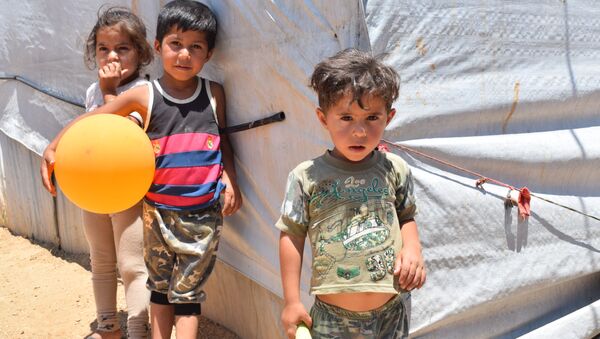 مخيم للنازحين السوريين في منطقة العقيدية في لبنان - سبوتنيك عربي