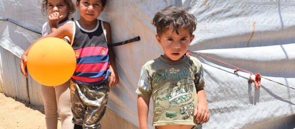 مخيم للنازحين السوريين في منطقة العقيدية في لبنان - سبوتنيك عربي