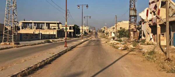 أهالي بلدة علما، في محافظة درعا، يعودون إلى منازلهم بعد تحريرها من مسلحي تنظيم داعش الإرهابي - سبوتنيك عربي