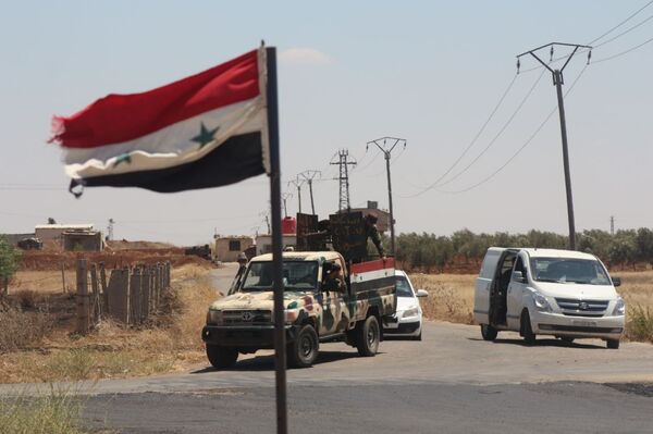 خروج المسلحين من بلدة محجة شمالي محافظة درعا - سبوتنيك عربي