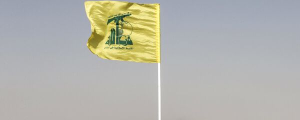 مقاتل لحزب الله أمام مدفع صاروخي مقاتل لحزب الله أمام مدفع صاروخي - سبوتنيك عربي