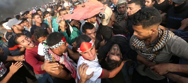 استمرار الاحتجاجات والمطالبة برفع الحصار عن قطاع غزة، الحدود بين قطاع غزة وإسرائيل، 19 أكتوبر/ تشرين الأول 2018 - سبوتنيك عربي