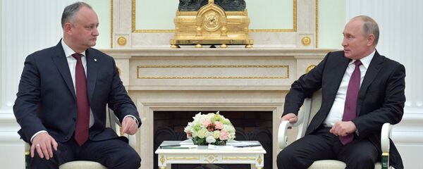 الرئيس المولدوفي إيغور دودون و الرئيس الروسي فلاديمير بوتين الرئيس المولدوفي إيغور دودون و الرئيس الروسي فلاديمير بوتين - سبوتنيك عربي