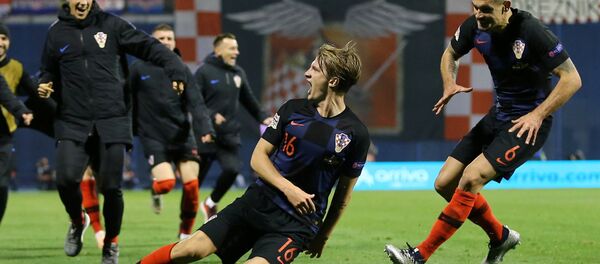 لاعبوا المنتخب الكرواتي يحتفلون بفوزهم على إسبانيا - سبوتنيك عربي