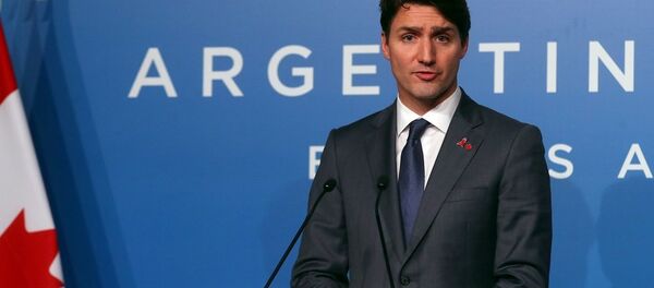 رئيس الوزراء الكندي، جاستين ترودو، في مؤتمر صحفي أثناء قمة العشرين في الأرجنتين رئيس الوزراء الكندي، جاستين ترودو، في مؤتمر صحفي أثناء قمة العشرين في الأرجنتين - سبوتنيك عربي