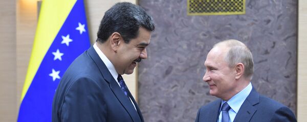 الرئيس الروسي فلاديمير بوتين ونظيره الفنزويلي نيكولاس مادورو - سبوتنيك عربي