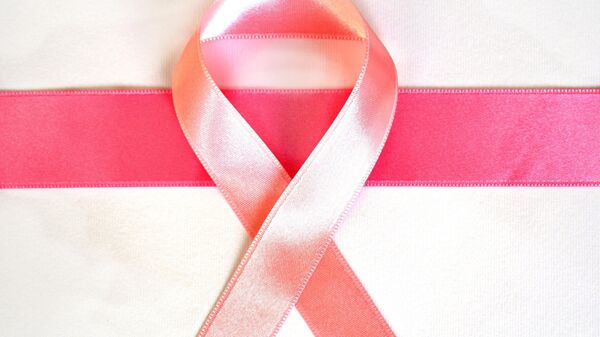 شعار محاربة سرطان الثدي - سبوتنيك عربي